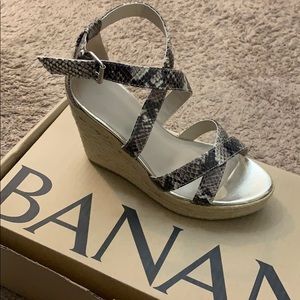 Never worn trendy snake skin espadrille wedges.
